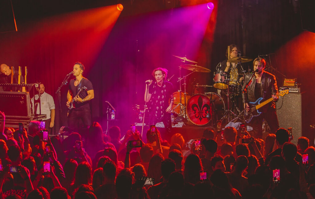 The Calling with Dom Liberati performing on stage in front of a crowd