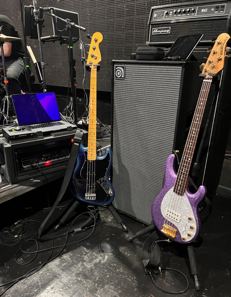 The Calling on tour stage with Ampeg Venture VB-88, SVT bass head, and 2 bass guitars