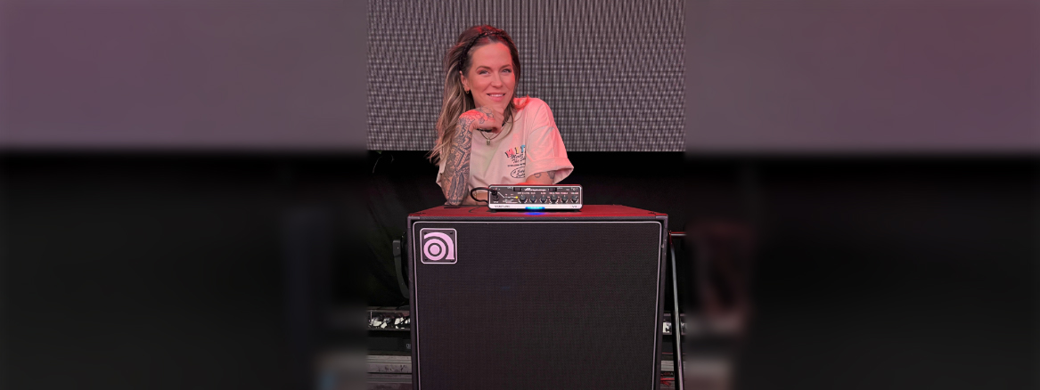 Moa Munoz standing behind and leaning on a Venture head and cab